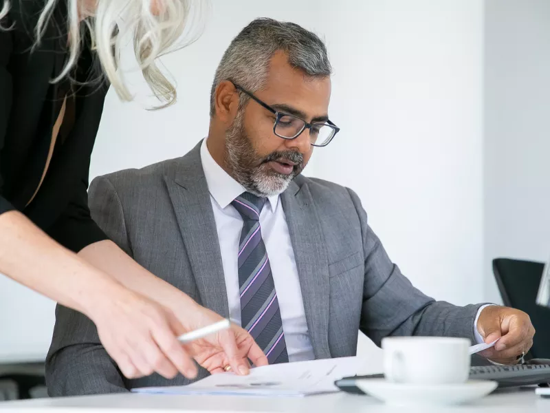Professional reviewing documents for highest paying jobs in the UK recruitment process.